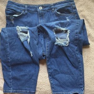INC size 26 denim jeans with wearout holes in front.